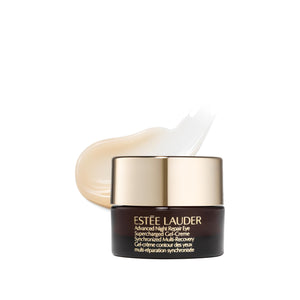 Estée Lauder eye cream with applicator on a white background