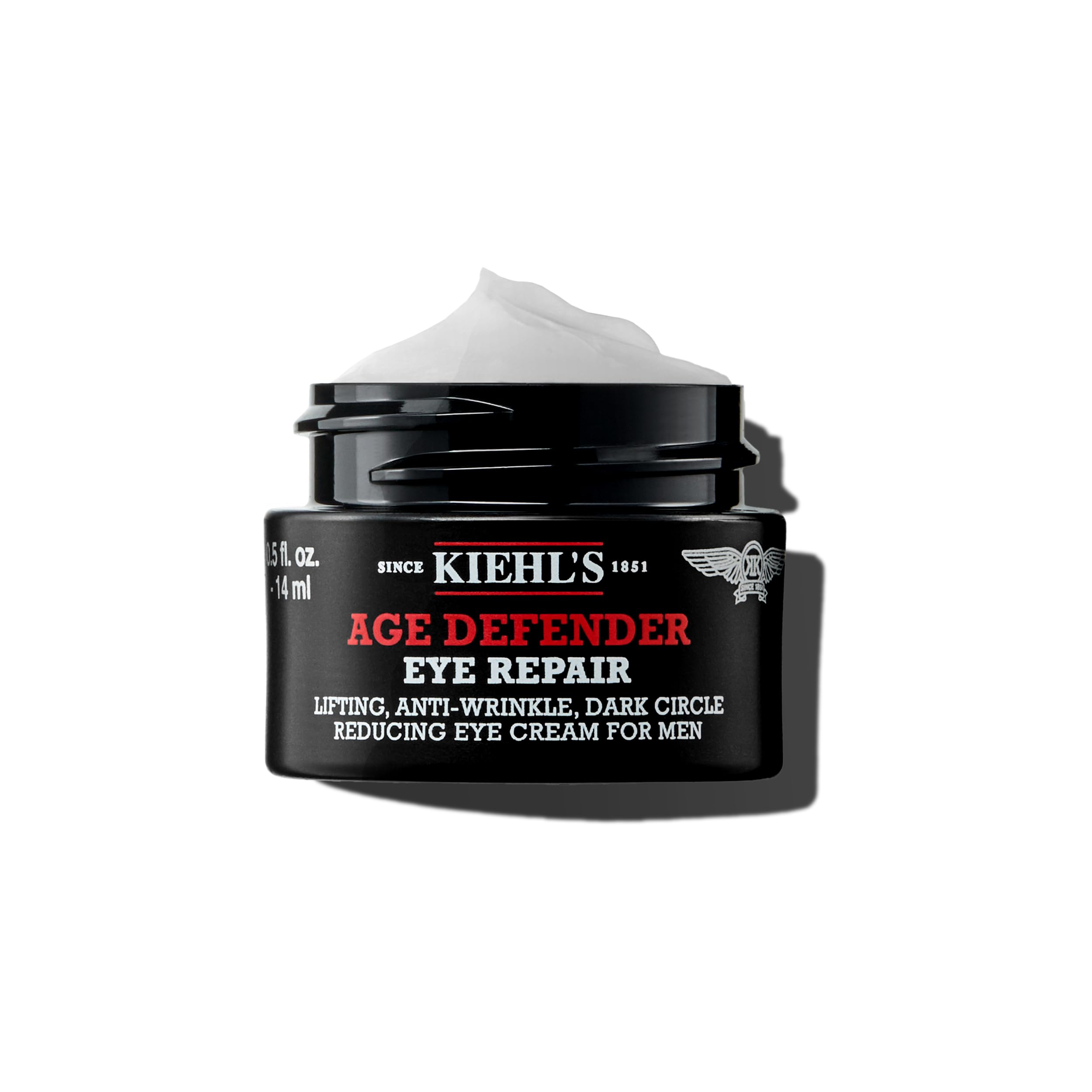 A 0.5 fl oz jar of Kiehl's Age Defender Eye Repair, a premium anti-aging treatment specifically formulated for men's skin.