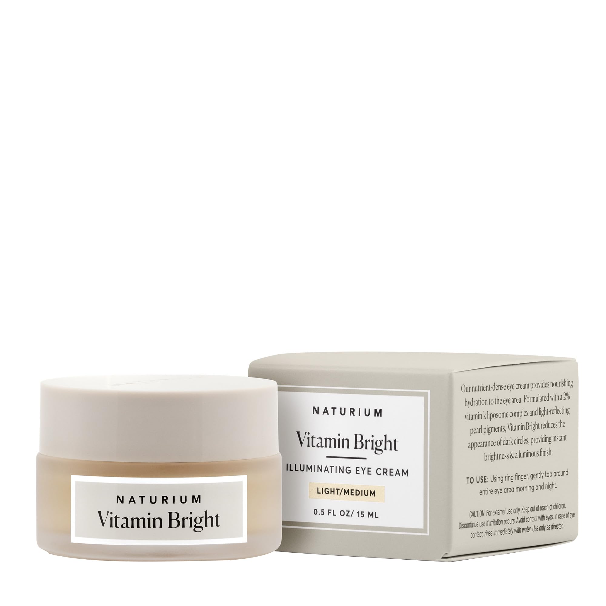 Tube of Naturium Vitamin Bright Illuminating Eye Cream, featuring a light/medium tint for correcting dark circles.