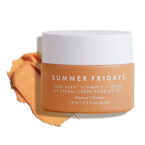 A 0.5 fl oz vibrant orange jar of Summer Fridays Light Aura Eye Cream with a rich, illuminating texture.